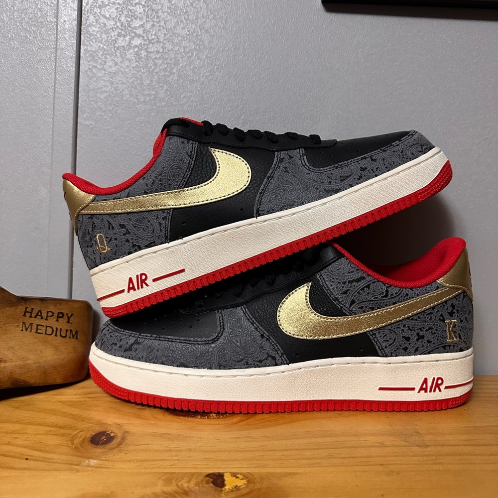 Nike Air Force 1 Black and Gold Sneakers